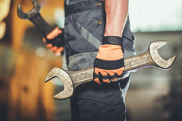 mechanic holding a wrench